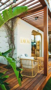 Elegant outdoor view of a Dior pop-up store with modern architecture.